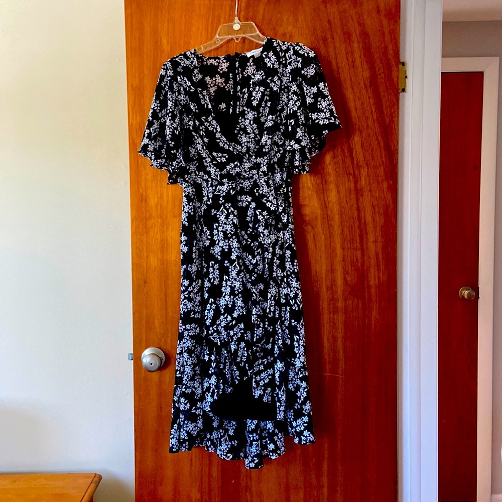 Black high low, wrap dress with white flower pattern